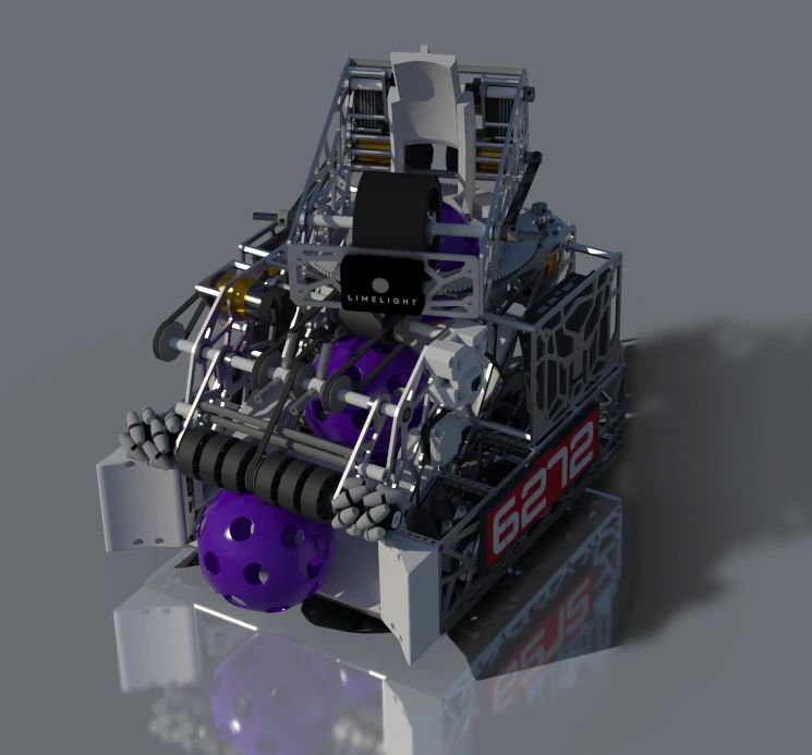 CAD render of the 2025-2026 robot from the front right: black rubber intake rollers at the bottom, a rotating upper section with a Limelight camera, and the team number 6272 on a red plate.
